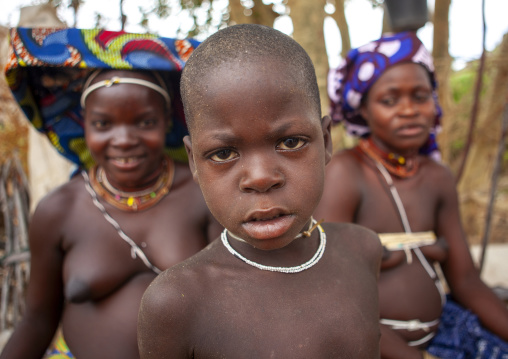 Mucubal tribe boy with women, Namibe Province, Virei, Angola