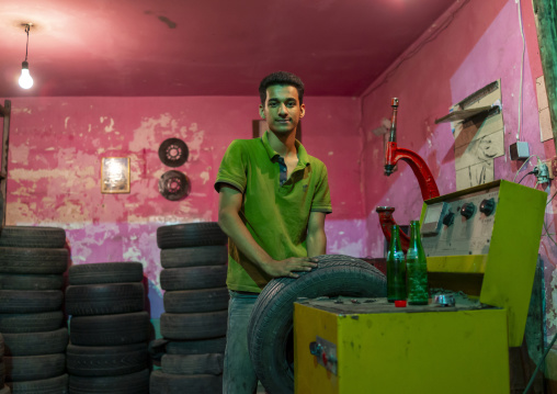 Man working in a garage, Kermanshah Province, Kermanshah, Iran