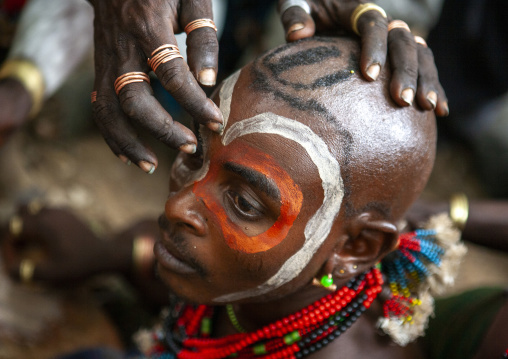Whippers making up during bull jumping in Hamer tribe, Omo valley, Turmi, Ethiopia