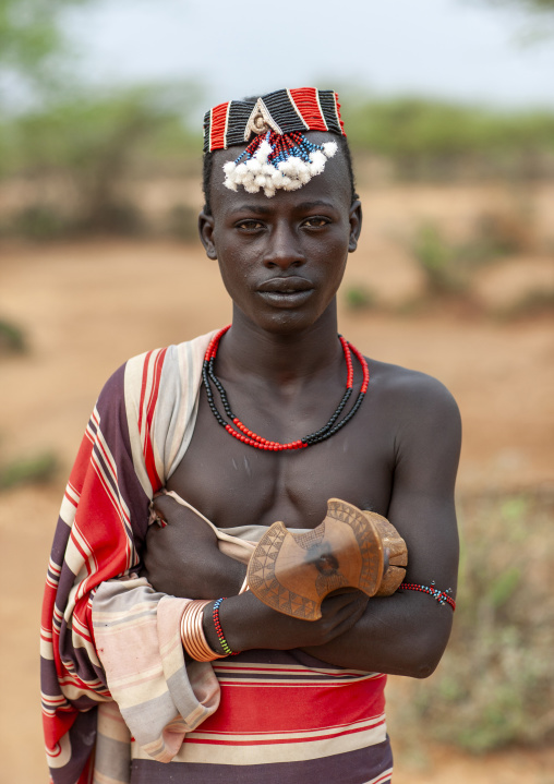 Hamer man dressed in traditional loincloth with a headrest, Omo valley, Turmi, Ethiopia