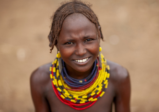 Dassanech teenage girl wearing beaded necklaces, Omo valley, Omorate, Ethiopia