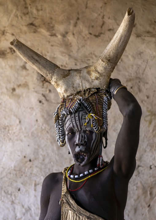 Mursi tribe woman with cow horns on her head, Omo valley, Hail Wuha, Ethiopia