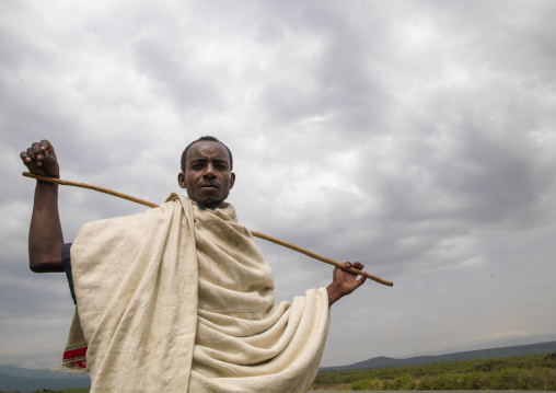 Portrait of a Karrayyu man with a stick, Oromia, Metahara, Ethiopia