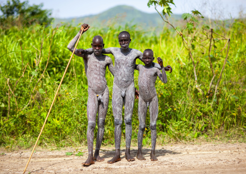 Surma warriors with clay body paintings, Turgit, Omo valley, Ethiopia