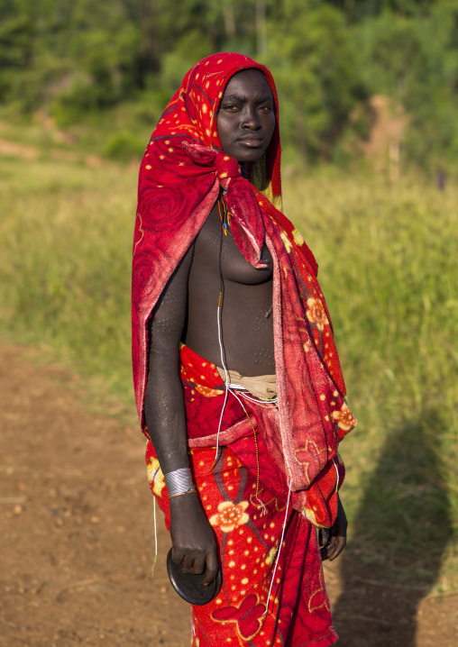 Surma woman with a red veil, Omo valley, Kibish, Ethiopia