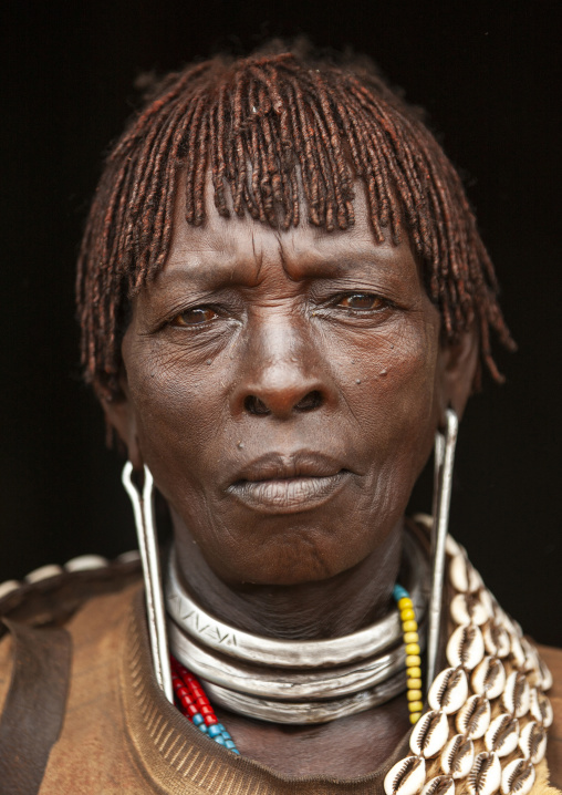 Banna tribe woman with traditional hairstyle and a necklaces, Key afer, Omo valley, Ethiopia