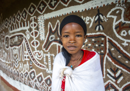 Girl posing in front of a decorated house, Oromia, Adama, Ethiopia