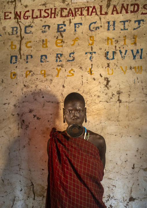 Mursi tribe woman in a school, Mago park, Omo valley, Ethiopia