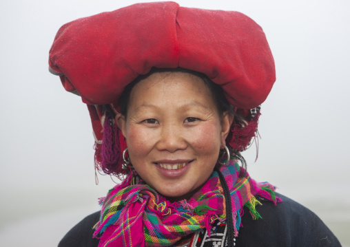 Smiling red dzao woman with traditional headgear, Lao Cai province, Sapa, Vietnam