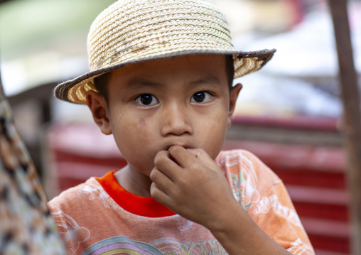 Portrait of a Lao boy with a hat, Champassak province, Pakse, Laos