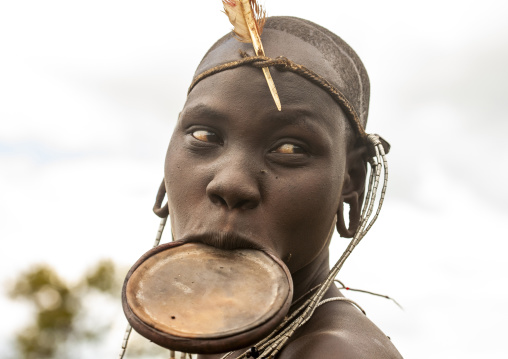 Portrait of a Mursi tribe woman with lip plate, Omo valley, Hana Mursi, Ethiopia