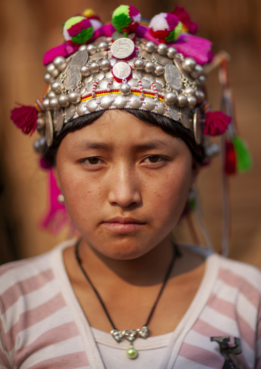 Akha minority young woman with traditional headdress, Luang Namtha, Ban Ta Mi, Laos