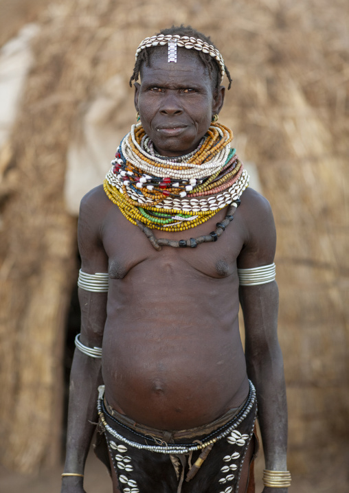 Nyangatom senior tribe woman with necklaces, Omo valley, Murile, Ethiopia