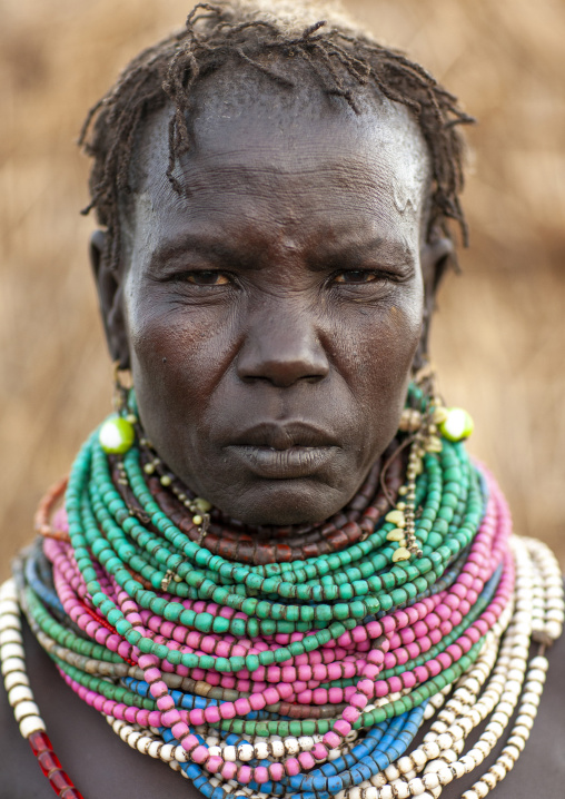 Nyangatom senior tribe woman with necklaces, Omo valley, Murile, Ethiopia