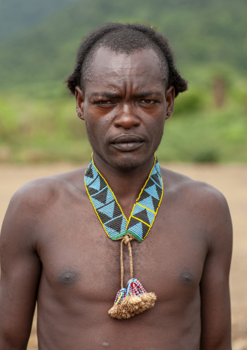 Portrait of a tsemay tribe man wearing beaded neclace, Omo Valley, Key Afer, Ethiopia