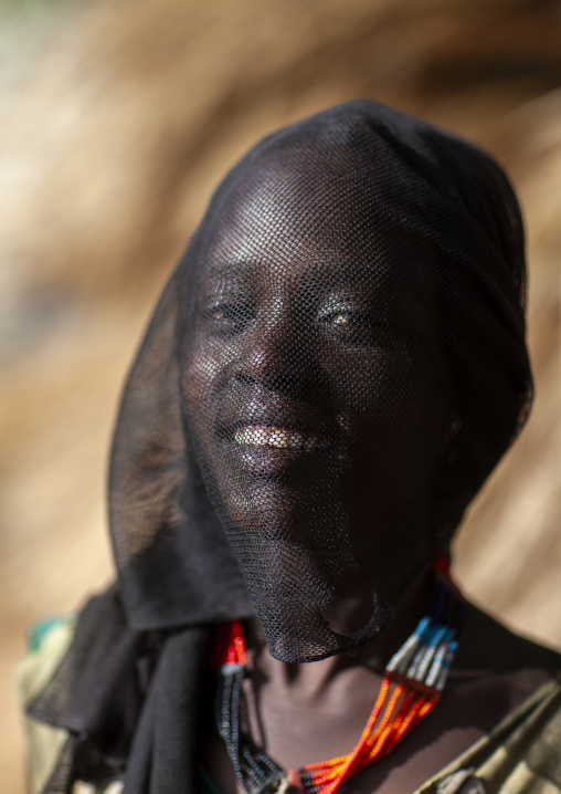 Konso teenage girl with veil on her face, South Ethiopia Regional State, Konso, Ethiopia