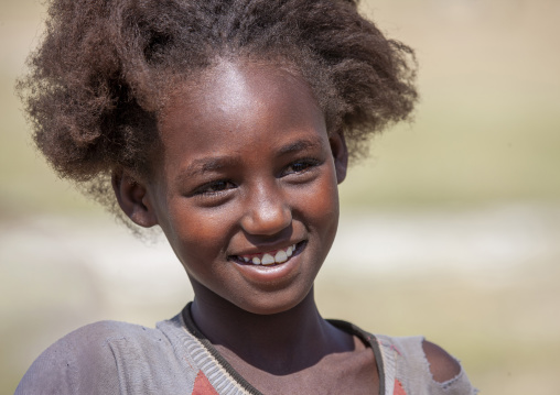 Portrait of a young girl smiling, South Ethiopia Regional State, Konso, Ethiopia