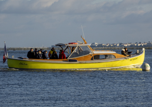 Boat with passengers in an oysters farm, Nouvelle-aquitaine, Cap Ferret, France