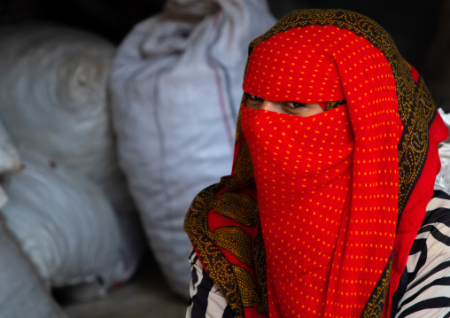 Bilen tribe woman with the face covered in the monday market, Semien-Keih-Bahri, Keren, Eritrea