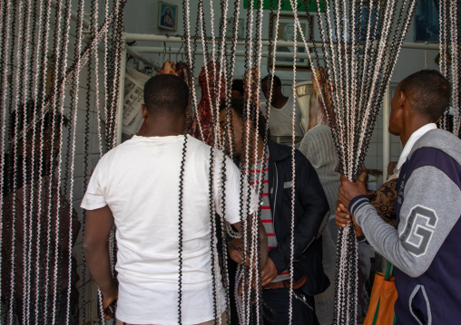 Eritrean men entering a butchery shop, Central region, Asmara, Eritrea