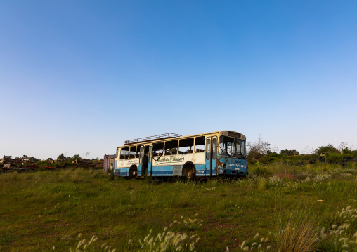 Old bus in the military tank graveyard, Central region, Asmara, Eritrea