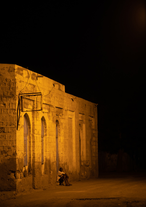 Man sitting in front of an ottoman building, Northern Red Sea, Massawa, Eritrea
