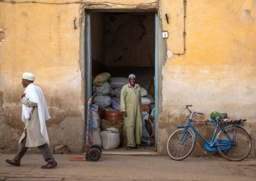 Eritrean man in front of a grain warehouse, Central region, Asmara, Eritrea