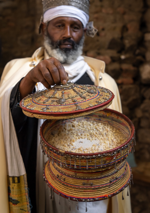Ethiopian orthodox priest with insence in nakuto lab rock church, Amhara Region, Lalibela, Ethiopia