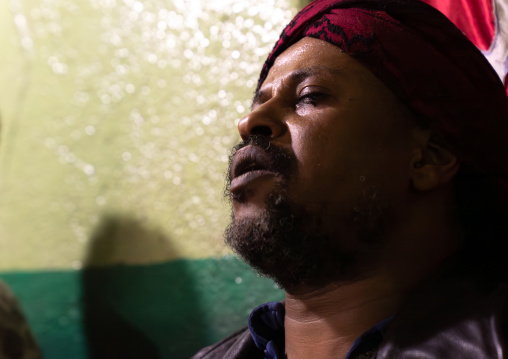 Ethiopian man in trance during a sufi ceremony in Ummi Tahir Nabigar, Harari Region, Harar, Ethiopia