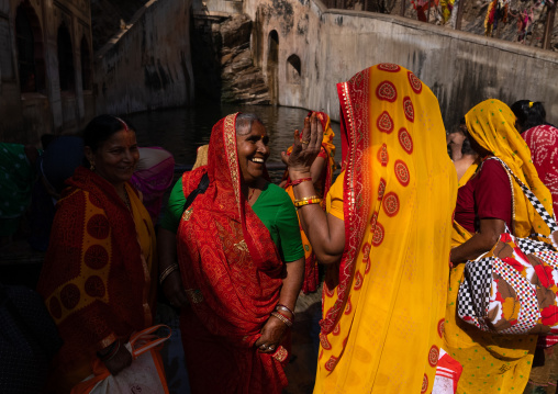 Indian pilgrims having a bath in Galtaji temple aka monkey temple, Rajasthan, Jaipur, India