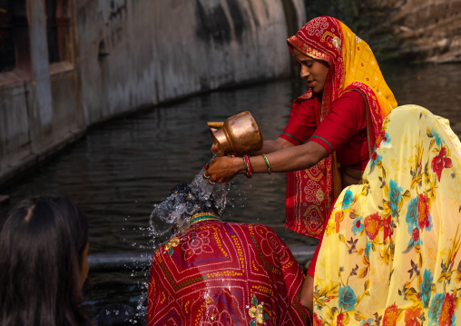 Indian pilgrims having a bath in Galtaji temple aka monkey temple, Rajasthan, Jaipur, India
