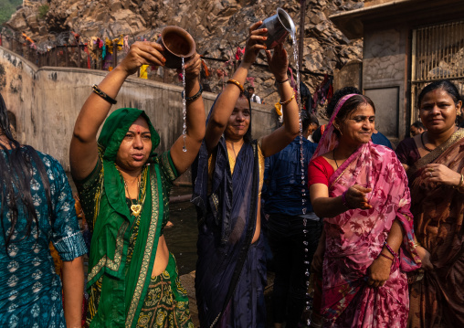 Indian pilgrims having a bath in Galtaji temple aka monkey temple, Rajasthan, Jaipur, India
