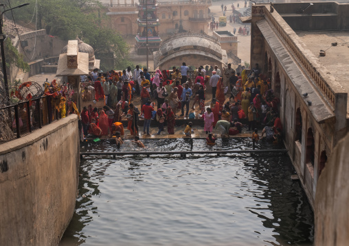 Indian pilgrims having a bath in Galtaji temple aka monkey temple, Rajasthan, Jaipur, India