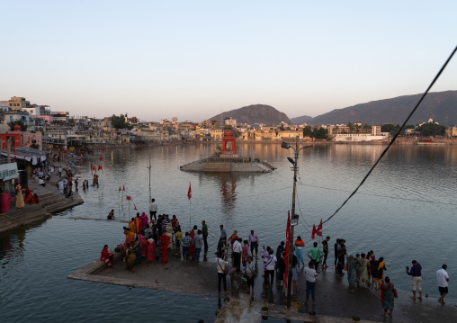 Indian pilgrims in Barhama lake and bathing ghats, Rajasthan, Pushkar, India