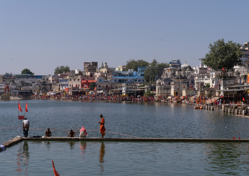Indian pilgrims in Barhama lake and bathing ghats, Rajasthan, Pushkar, India