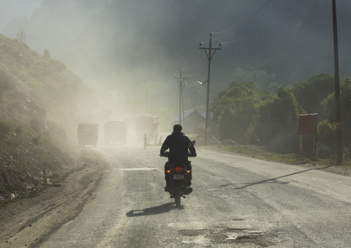 Motorbike on a dusty road, Jammu and Kashmir, Sonamarg, India
