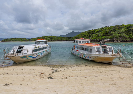 Glass bottom boats in tropical lagoon in Kabira bay, Yaeyama Islands, Ishigaki, Japan