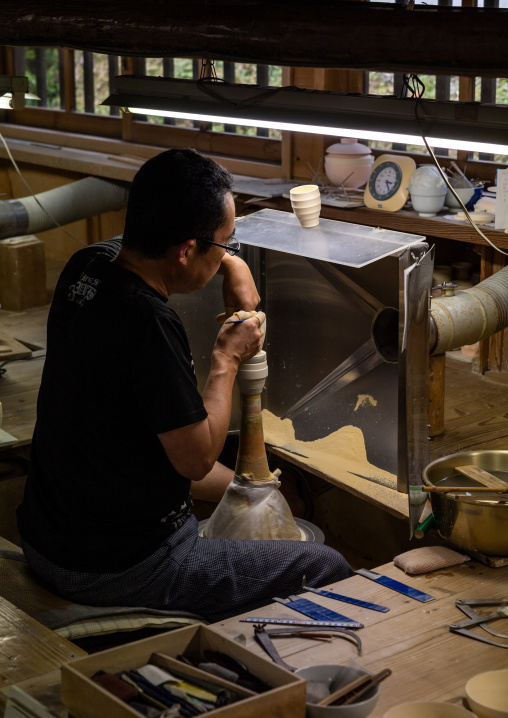 Artisan in Genemongama porcelain atelier, Kyushu region, Arita, Japan