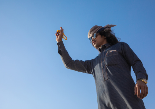 Saudi man dancing during King Abdul Aziz Camel Festival, Riyadh Province, Rimah, Saudi Arabia