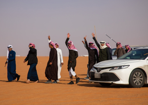 Saudi men dancing during King Abdul Aziz Camel Festival, Riyadh Province, Rimah, Saudi Arabia