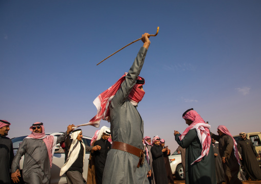 Saudi men dancing during King Abdul Aziz Camel Festival, Riyadh Province, Rimah, Saudi Arabia