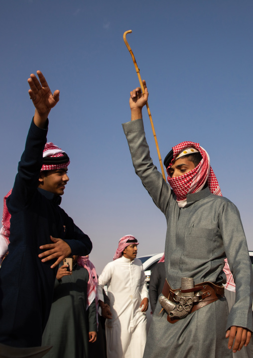 Saudi men dancing during King Abdul Aziz Camel Festival, Riyadh Province, Rimah, Saudi Arabia