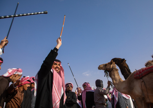 Saudi men dancing during King Abdul Aziz Camel Festival, Riyadh Province, Rimah, Saudi Arabia