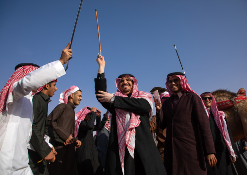 Saudi men dancing during King Abdul Aziz Camel Festival, Riyadh Province, Rimah, Saudi Arabia