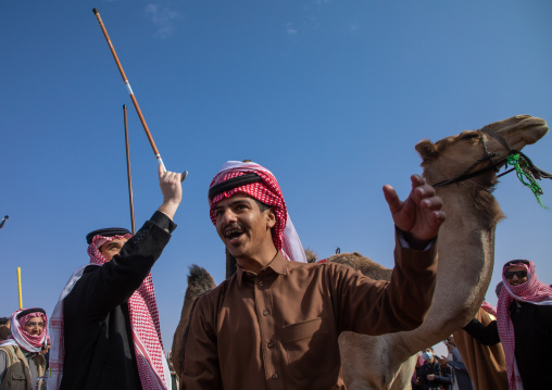 Saudi men dancing during King Abdul Aziz Camel Festival, Riyadh Province, Rimah, Saudi Arabia