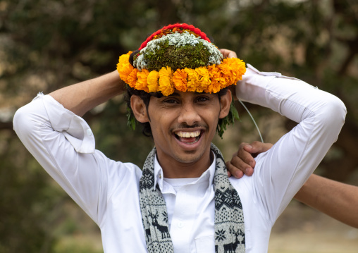 Portrait of a flower man wearing a floral crown on the head, Asir province, Sarat Abidah, Saudi Arabia