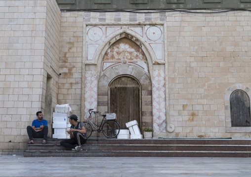 Men in front of an old heritage door building, North Governorate, Tripoli, Lebanon