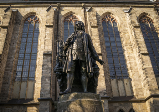 Statue of composer Johann Sebastian Bach with organ in front of St Thomas Church, Saxony, Leipzig, Germany