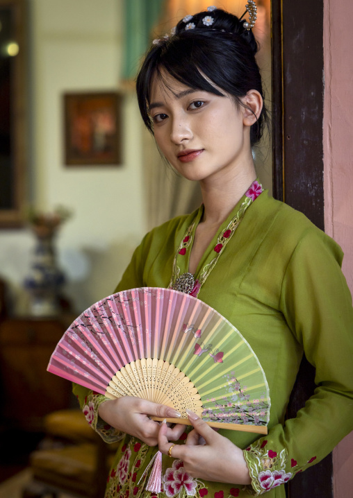 Young chinese woman dressed in traditional clothing in Pinang Peranakan mansion, Penang island, George Town, Malaysia