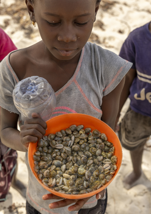 Boy with collected shells, Nampula Province, Island of Mozambique, Mozambique